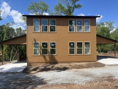 This newly constructed 2,470 sq ft unit features 2 spacious on Shangri La Golf Resort and Club in Oklahoma - for sale on GolfHomes.com, golf home, golf lot