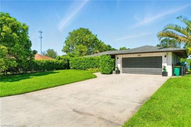 Nestled in an up-and-coming neighborhood backing up to a on Golden Gate Country Club in Florida - for sale on GolfHomes.com, golf home, golf lot