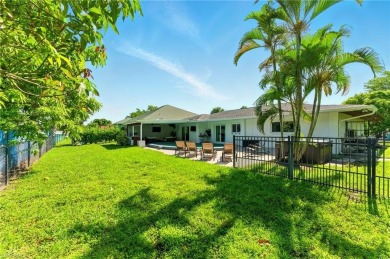 Nestled in an up-and-coming neighborhood backing up to a on Golden Gate Country Club in Florida - for sale on GolfHomes.com, golf home, golf lot