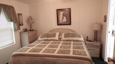 Welcome to this nice and quaint 2-bedroom home, complete with a on Schalamar Creek Golf and Country Club in Florida - for sale on GolfHomes.com, golf home, golf lot
