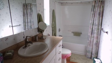 Welcome to this nice and quaint 2-bedroom home, complete with a on Schalamar Creek Golf and Country Club in Florida - for sale on GolfHomes.com, golf home, golf lot