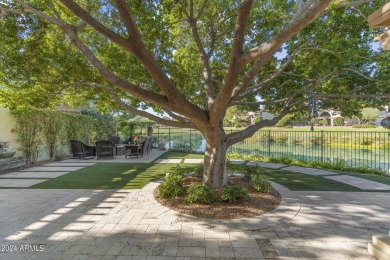 Welcome to this charming single-level home, nestled on the lake on Arizona Biltmore Golf and Country Club in Arizona - for sale on GolfHomes.com, golf home, golf lot