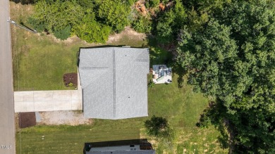 Competitively priced charming ranch style home w/  3 bed/2 bath on River Golf and County Club at Lake Royale in North Carolina - for sale on GolfHomes.com, golf home, golf lot