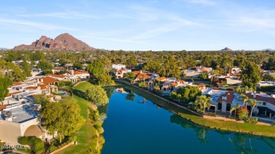 Welcome to this charming single-level home, nestled on the lake on Arizona Biltmore Golf and Country Club in Arizona - for sale on GolfHomes.com, golf home, golf lot