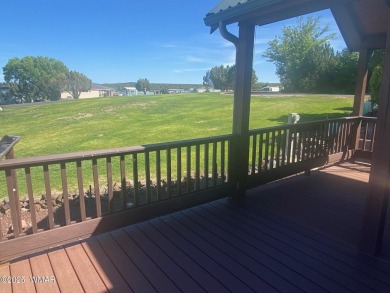 Enjoy the lovely view from the deck overlooking the greenbelt on Juniper Ridge R.V. Golf Resort in Arizona - for sale on GolfHomes.com, golf home, golf lot
