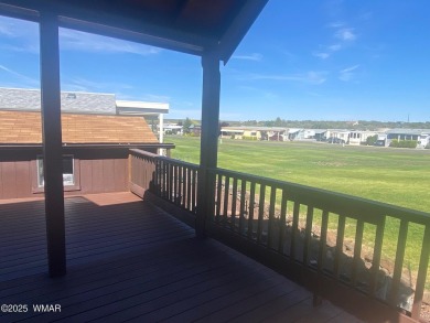 Enjoy the lovely view from the deck overlooking the greenbelt on Juniper Ridge R.V. Golf Resort in Arizona - for sale on GolfHomes.com, golf home, golf lot