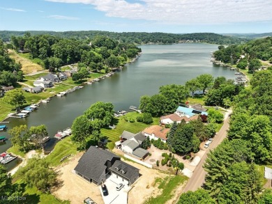 Welcome to your waterside retreat at Lake Mohawk! This on Lake Mohawk Golf Club in Ohio - for sale on GolfHomes.com, golf home, golf lot