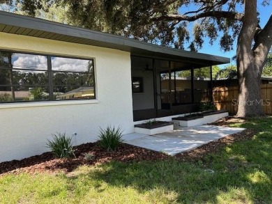 Experience the best of Dunedin living in this meticulously on The Dunedin Country Club in Florida - for sale on GolfHomes.com, golf home, golf lot