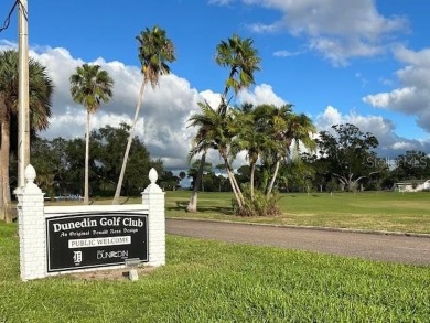 Experience the best of Dunedin living in this meticulously on The Dunedin Country Club in Florida - for sale on GolfHomes.com, golf home, golf lot