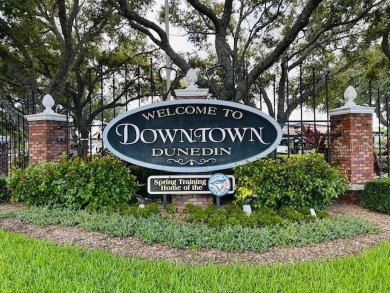 Experience the best of Dunedin living in this meticulously on The Dunedin Country Club in Florida - for sale on GolfHomes.com, golf home, golf lot