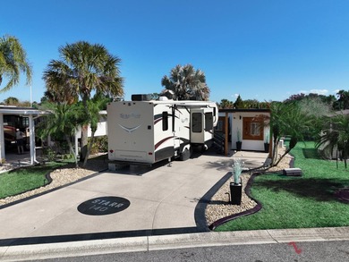 This beautifully updated and modern Executive Suite sits on an on The Great Outdoors Golf and Country Club in Florida - for sale on GolfHomes.com, golf home, golf lot