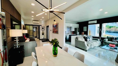 This beautifully updated and modern Executive Suite sits on an on The Great Outdoors Golf and Country Club in Florida - for sale on GolfHomes.com, golf home, golf lot