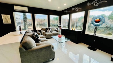 This beautifully updated and modern Executive Suite sits on an on The Great Outdoors Golf and Country Club in Florida - for sale on GolfHomes.com, golf home, golf lot