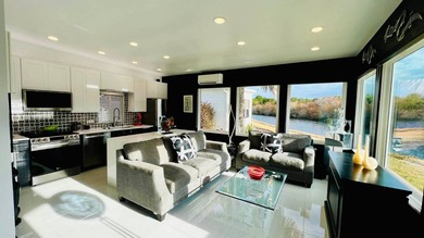 This beautifully updated and modern Executive Suite sits on an on The Great Outdoors Golf and Country Club in Florida - for sale on GolfHomes.com, golf home, golf lot