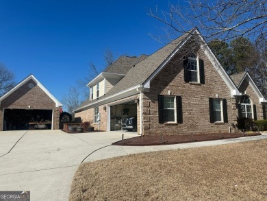 Gorgeous 4-sided brick 5 bedroom, 3.5 bathroom home on almost 1 on Cedar Lake Golf Club in Georgia - for sale on GolfHomes.com, golf home, golf lot