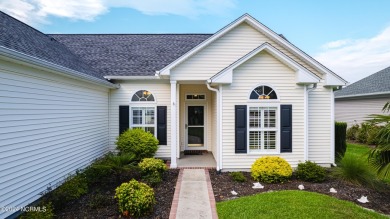 Discover this spacious 3-bedroom home with stunning pond views on Sandpiper Bay Golf and Country Club in North Carolina - for sale on GolfHomes.com, golf home, golf lot