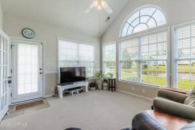 Discover this spacious 3-bedroom home with stunning pond views on Sandpiper Bay Golf and Country Club in North Carolina - for sale on GolfHomes.com, golf home, golf lot