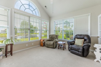 Discover this spacious 3-bedroom home with stunning pond views on Sandpiper Bay Golf and Country Club in North Carolina - for sale on GolfHomes.com, golf home, golf lot