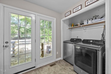 Discover your dream ranch home in this inviting lake community on River Golf and County Club at Lake Royale in North Carolina - for sale on GolfHomes.com, golf home, golf lot