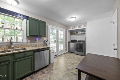 Discover your dream ranch home in this inviting lake community on River Golf and County Club at Lake Royale in North Carolina - for sale on GolfHomes.com, golf home, golf lot