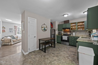 Discover your dream ranch home in this inviting lake community on River Golf and County Club at Lake Royale in North Carolina - for sale on GolfHomes.com, golf home, golf lot