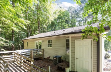 Discover your dream ranch home in this inviting lake community on River Golf and County Club at Lake Royale in North Carolina - for sale on GolfHomes.com, golf home, golf lot