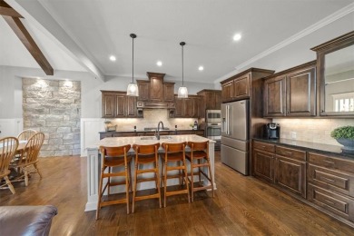 Experience elegance and timeless craftsmanship in this on Heritage Park Golf Course in Kansas - for sale on GolfHomes.com, golf home, golf lot