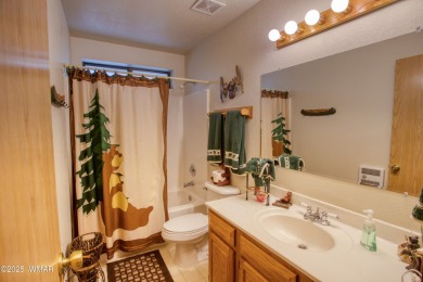 Tucked beneath towering pines in the heart of Pinetop Country on Pinetop Lakes Golf and Country Club in Arizona - for sale on GolfHomes.com, golf home, golf lot