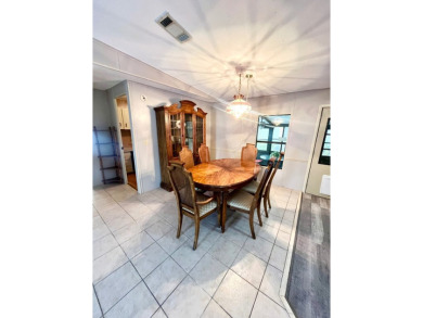 Looking for a well-maintained home in a vibrant gated golf on Pine Lakes Country Club in Florida - for sale on GolfHomes.com, golf home, golf lot
