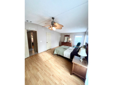 Looking for a well-maintained home in a vibrant gated golf on Pine Lakes Country Club in Florida - for sale on GolfHomes.com, golf home, golf lot