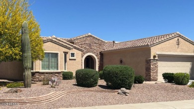 Handsome stone trimmed exterior! Desert Rose model offers an on Cimarron Golf Club in Arizona - for sale on GolfHomes.com, golf home, golf lot