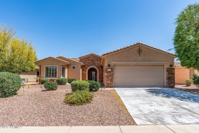 Handsome stone trimmed exterior! Desert Rose model offers an on Cimarron Golf Club in Arizona - for sale on GolfHomes.com, golf home, golf lot