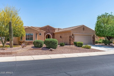 Handsome stone trimmed exterior! Desert Rose model offers an on Cimarron Golf Club in Arizona - for sale on GolfHomes.com, golf home, golf lot