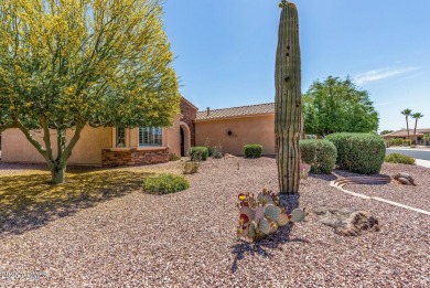 Handsome stone trimmed exterior! Desert Rose model offers an on Cimarron Golf Club in Arizona - for sale on GolfHomes.com, golf home, golf lot