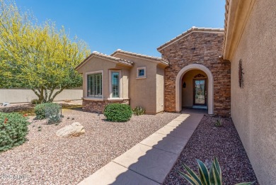 Handsome stone trimmed exterior! Desert Rose model offers an on Cimarron Golf Club in Arizona - for sale on GolfHomes.com, golf home, golf lot
