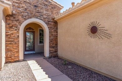 Handsome stone trimmed exterior! Desert Rose model offers an on Cimarron Golf Club in Arizona - for sale on GolfHomes.com, golf home, golf lot
