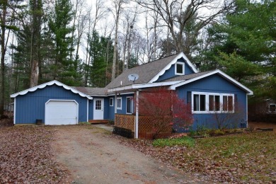 Discover the perfect retreat in this cozy chalet, ideally on Burning Oak Country Club in Michigan - for sale on GolfHomes.com, golf home, golf lot