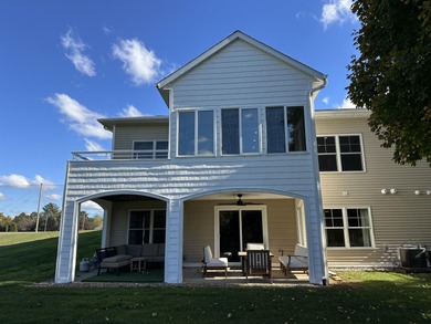 This home overlooks the pristine Lake Michigan Hills Golf Course on Lake Michigan Hills Golf Club in Michigan - for sale on GolfHomes.com, golf home, golf lot