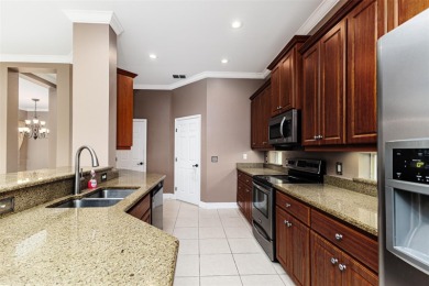 Welcome to this beautiful 3-bedroom, 2-bath lakefront home on Grasslands Golf and Country Club in Florida - for sale on GolfHomes.com, golf home, golf lot