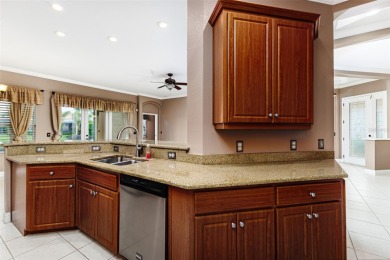 Welcome to this beautiful 3-bedroom, 2-bath lakefront home on Grasslands Golf and Country Club in Florida - for sale on GolfHomes.com, golf home, golf lot