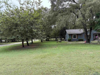Charming Corner Lot nestled in the serene, gated community of on Holly Lake Ranch Golf Club in Texas - for sale on GolfHomes.com, golf home, golf lot