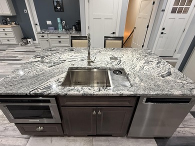 This home overlooks the pristine Lake Michigan Hills Golf Course on Lake Michigan Hills Golf Club in Michigan - for sale on GolfHomes.com, golf home, golf lot