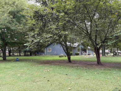 Charming Corner Lot nestled in the serene, gated community of on Holly Lake Ranch Golf Club in Texas - for sale on GolfHomes.com, golf home, golf lot