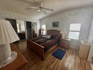 PRICE REDUCED $10,000! Nestled on a quiet lot on La Costa Lane on Four Lakes Golf Club in Florida - for sale on GolfHomes.com, golf home, golf lot