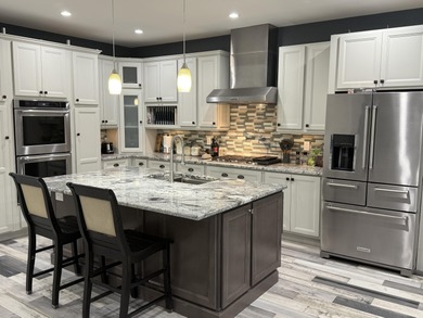 This home overlooks the pristine Lake Michigan Hills Golf Course on Lake Michigan Hills Golf Club in Michigan - for sale on GolfHomes.com, golf home, golf lot