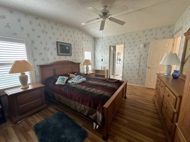PRICE REDUCED $10,000! Nestled on a quiet lot on La Costa Lane on Four Lakes Golf Club in Florida - for sale on GolfHomes.com, golf home, golf lot