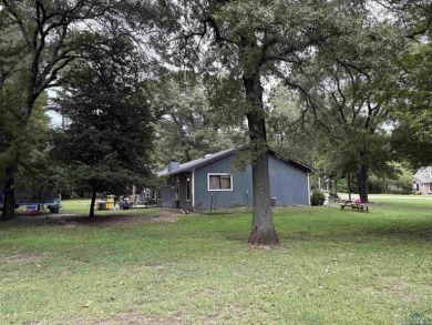 Charming Corner Lot nestled in the serene, gated community of on Holly Lake Ranch Golf Club in Texas - for sale on GolfHomes.com, golf home, golf lot