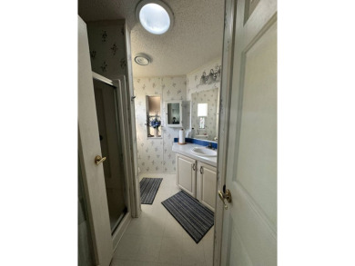 PRICE REDUCED $10,000! Nestled on a quiet lot on La Costa Lane on Four Lakes Golf Club in Florida - for sale on GolfHomes.com, golf home, golf lot