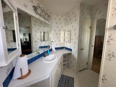 PRICE REDUCED $10,000! Nestled on a quiet lot on La Costa Lane on Four Lakes Golf Club in Florida - for sale on GolfHomes.com, golf home, golf lot