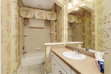 Welcome to this beautiful 3-bedroom, 2-bath lakefront home on Grasslands Golf and Country Club in Florida - for sale on GolfHomes.com, golf home, golf lot